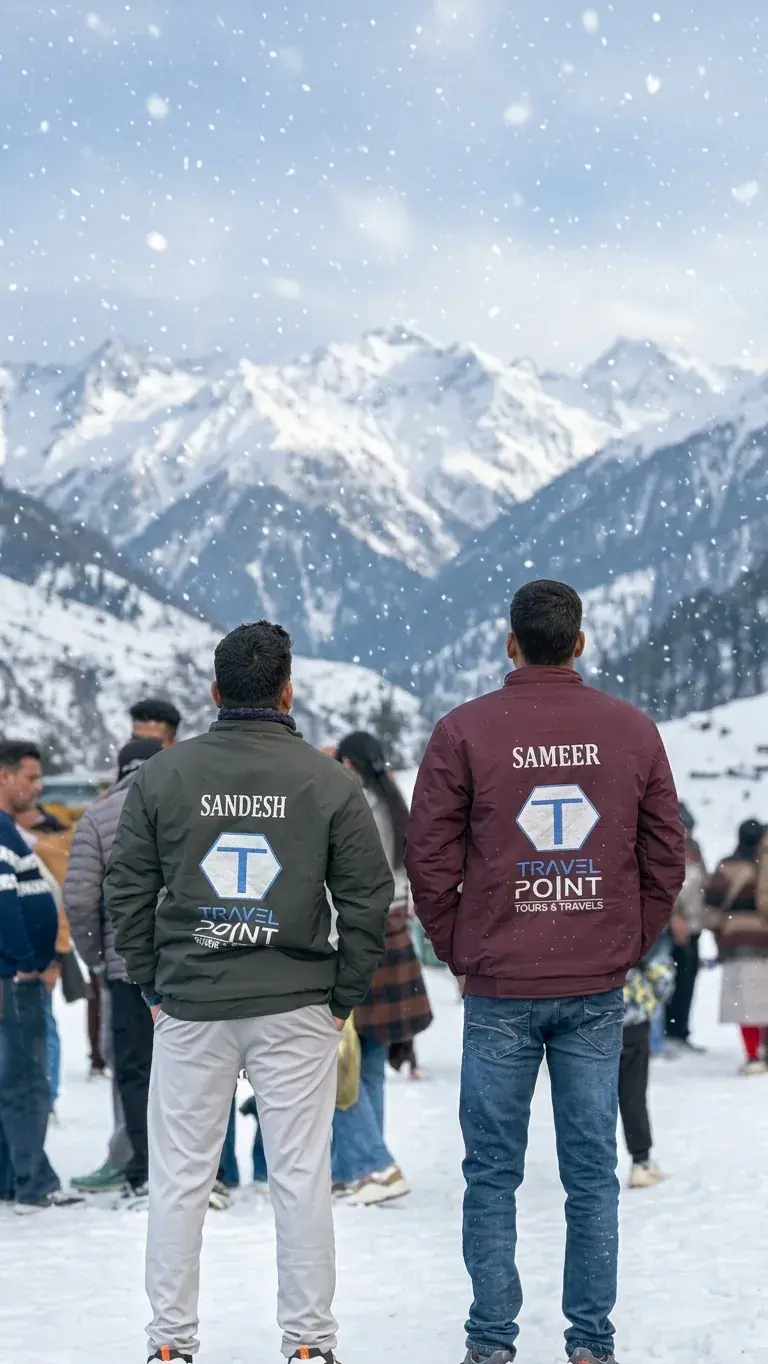 Sandesh and Sameer in Travel Point jackets, standing together with their group in the snow